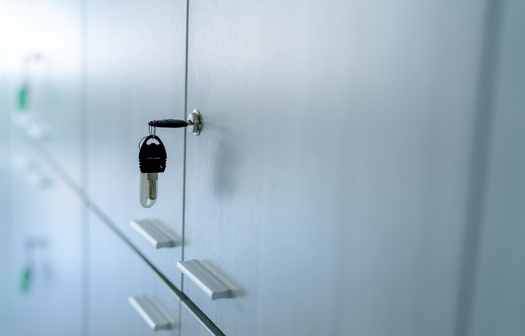 Glass office door with lock representing controlled access.