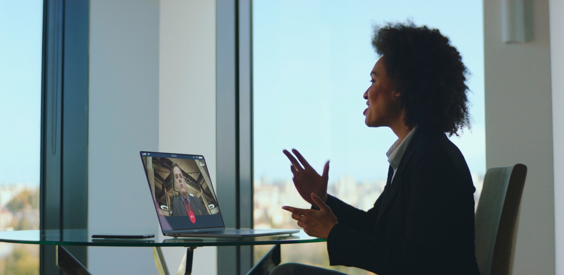 Remote reviewer working through a video call and laptop.