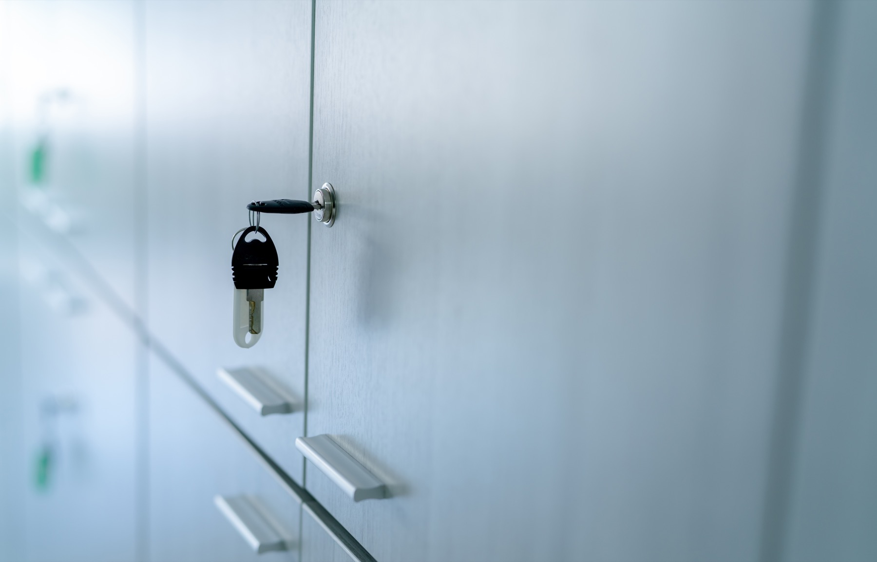 Glass office door with lock representing controlled access.